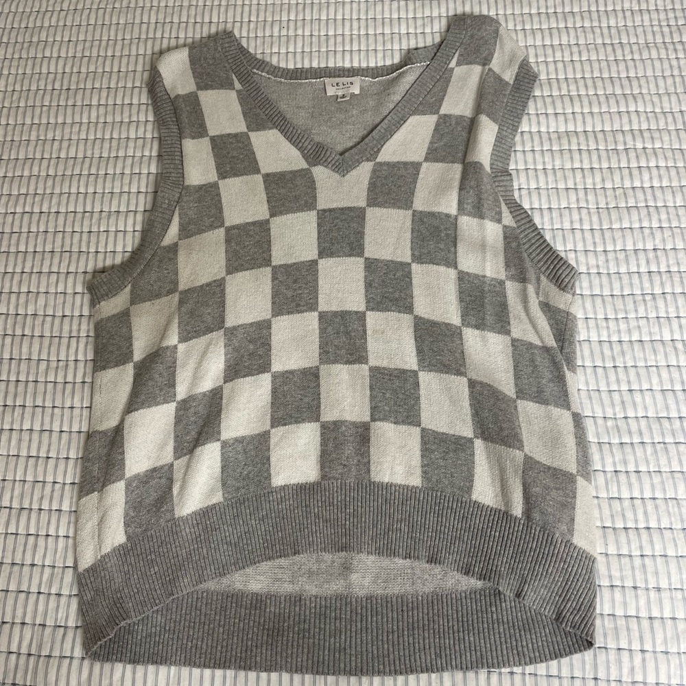 Checkered gray and white sweater vest